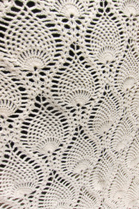 Detail of vintage off-white crochet blanket